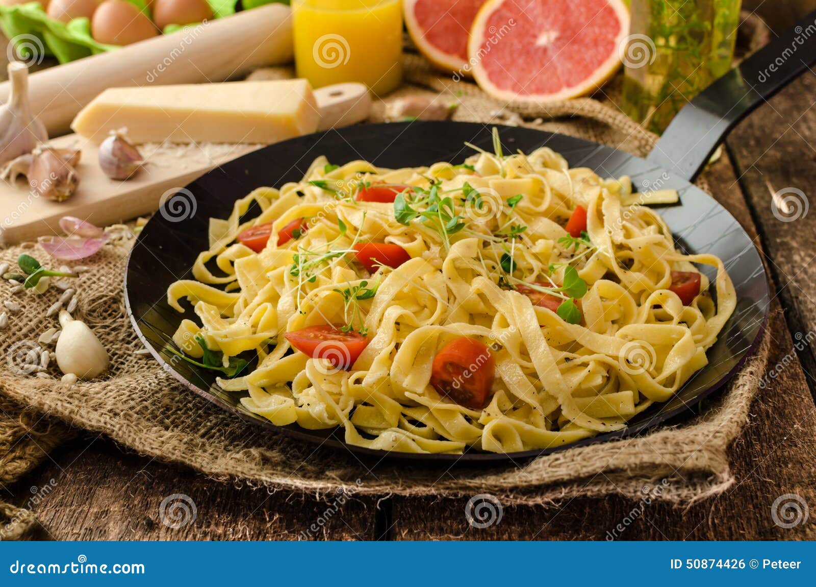 Semolina Pasta with Roasted Garlic, Sprinkled Microherbs Stock Photo