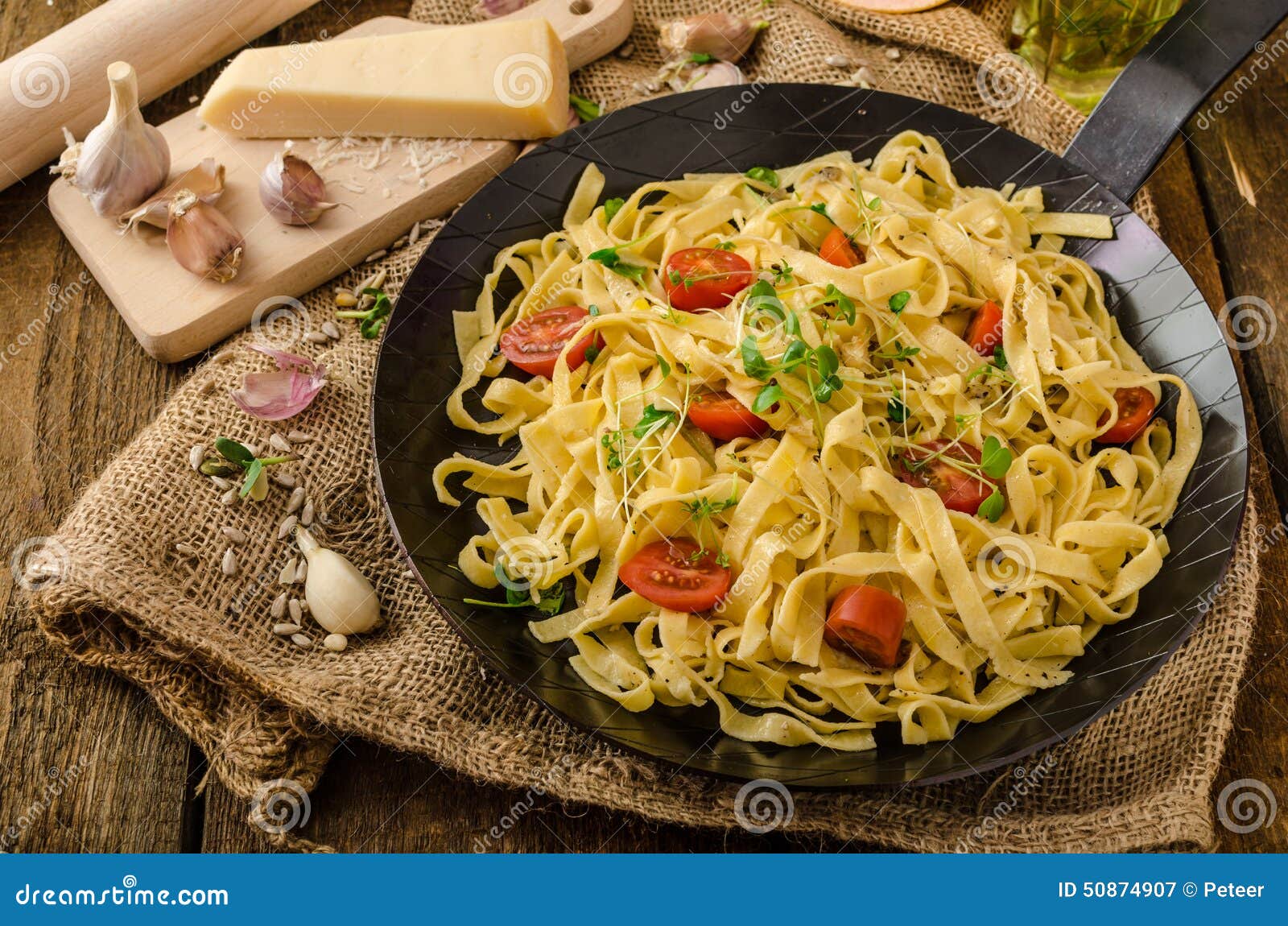 Semolina Pasta with Roasted Garlic, Sprinkled Microherbs Stock Image