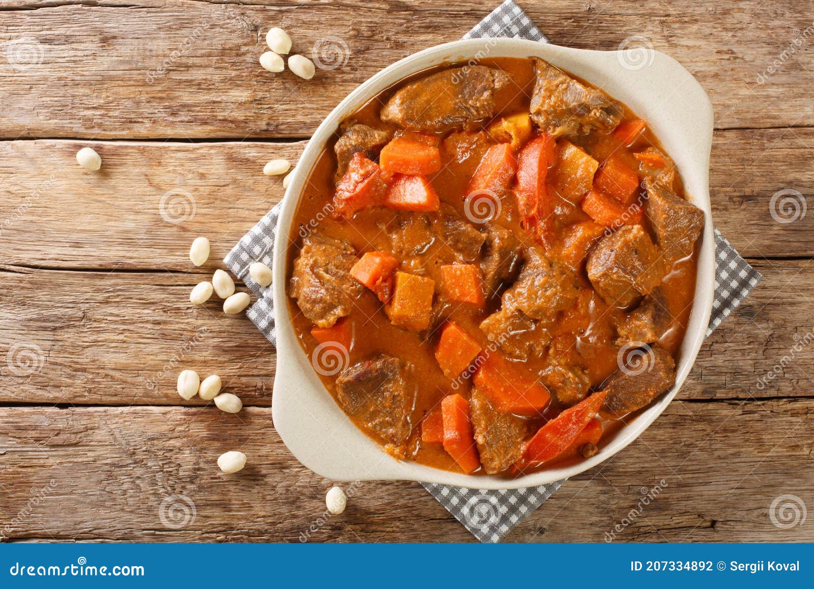 senegalese stew of beef in peanut sauce with vegetables close-up in a dish. horizontal top view