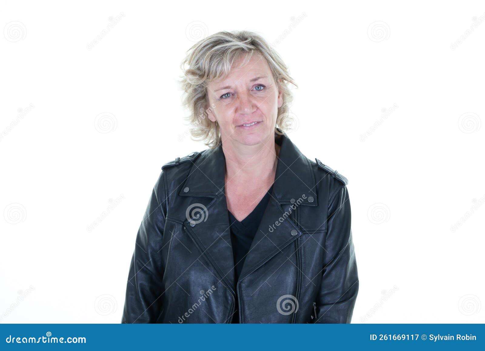 senior aged woman in her 60s biker with a black leather perfecto jacket on a white background