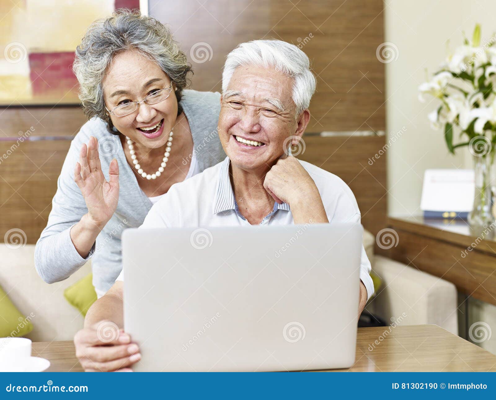 senior asian couple chatting online