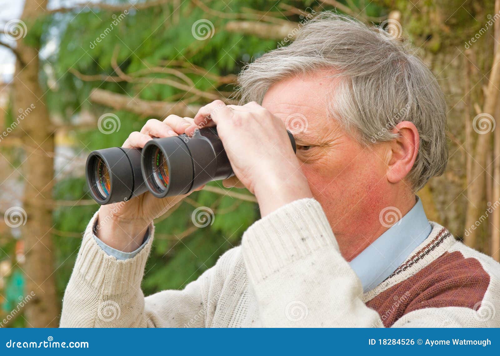 Senior with binoculars. stock photo. Image of garden 18284526