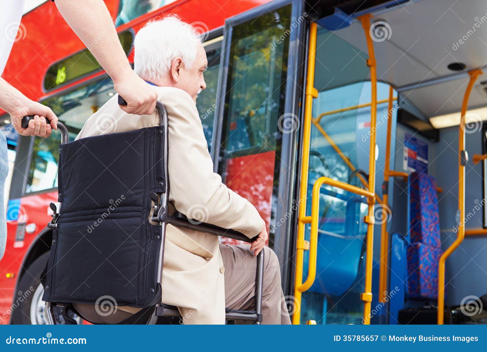 senior couple boarding bus using wheelchair access ramp