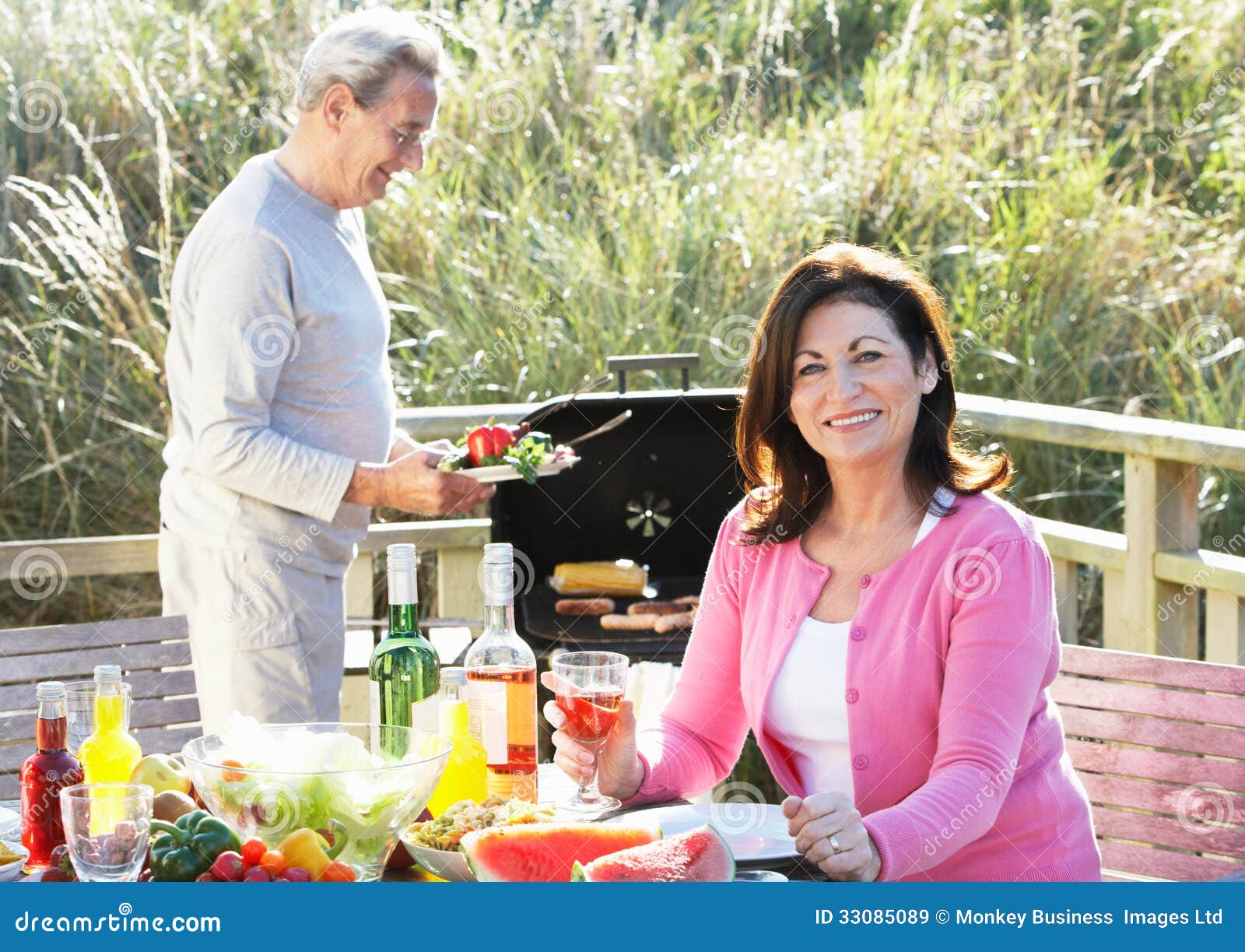 Senior Couple Having Outdoor Barbeque Stock Image - Image of smiling ...