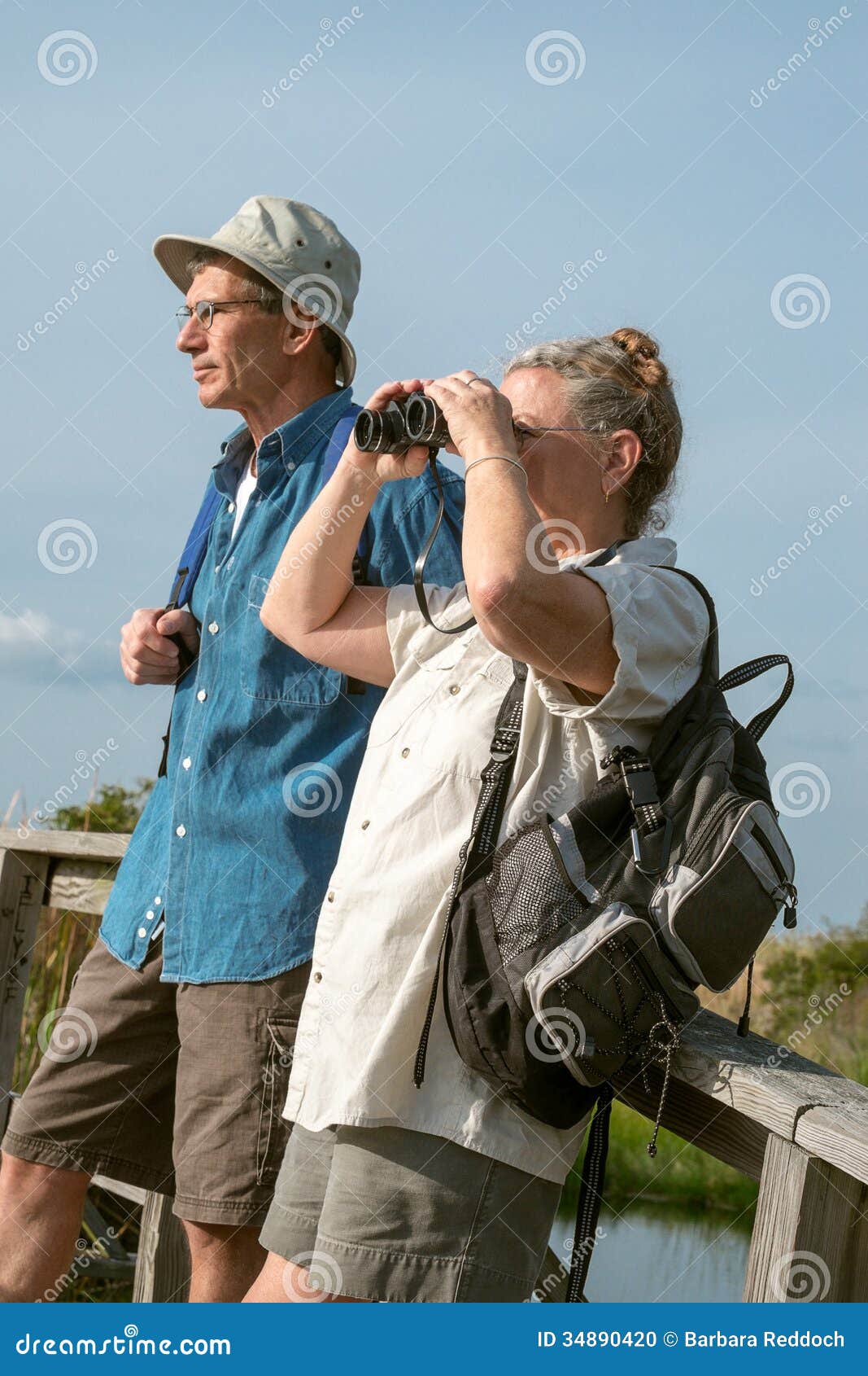 Senior Couple Hiking And Birdwatching Stock Photo - Image ...