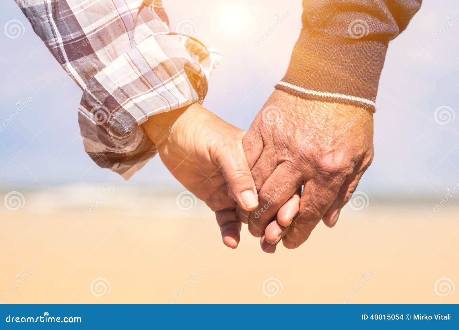Senior Couple in Love Walking at the Beach Holding Hands Stock ...