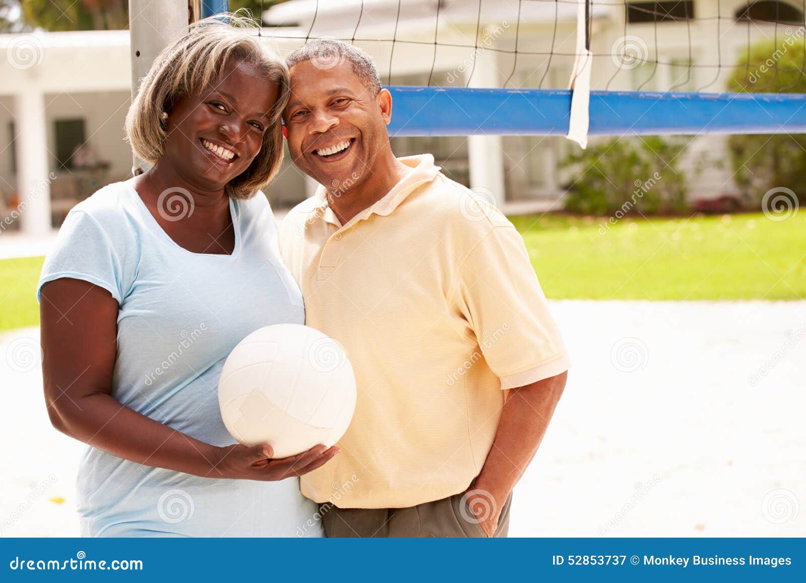 Senior Couple Playing Volleyball Together Stock Image Image of