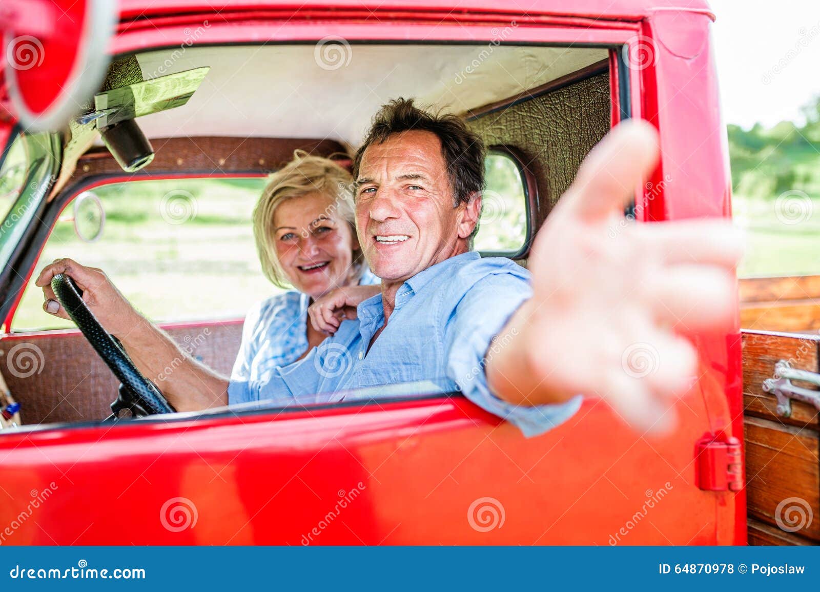 Senior couple in red car stock photo. Image of mature - 64870978