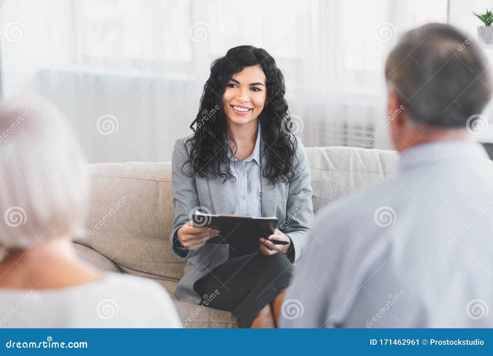 Senior Couple Talking To Financial Advisor At Her Office Stock Image