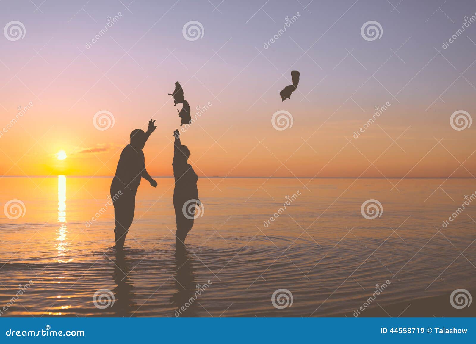Senior couple throws shoes stock image. Image of space 44558719