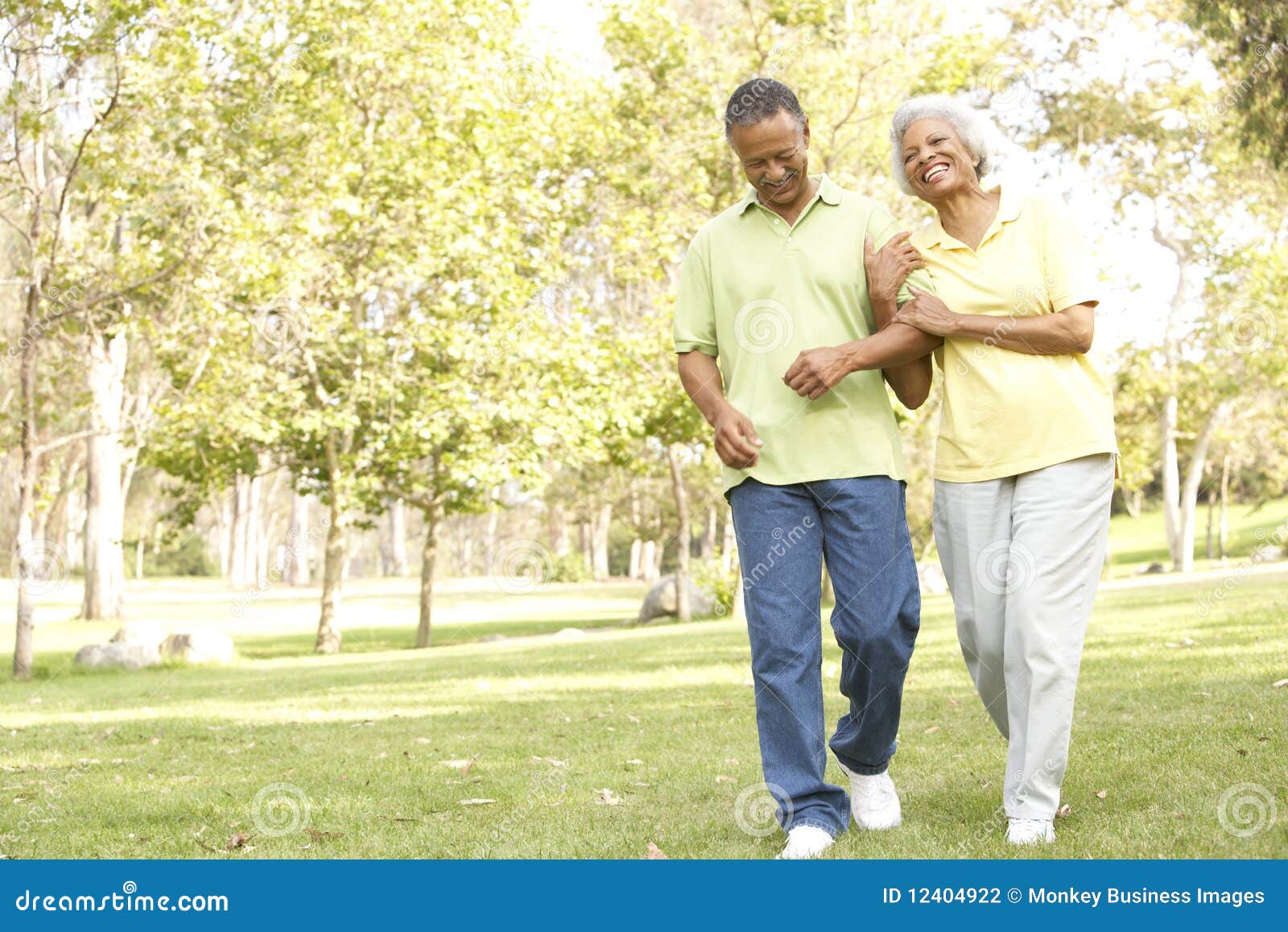 senior couple walking in park