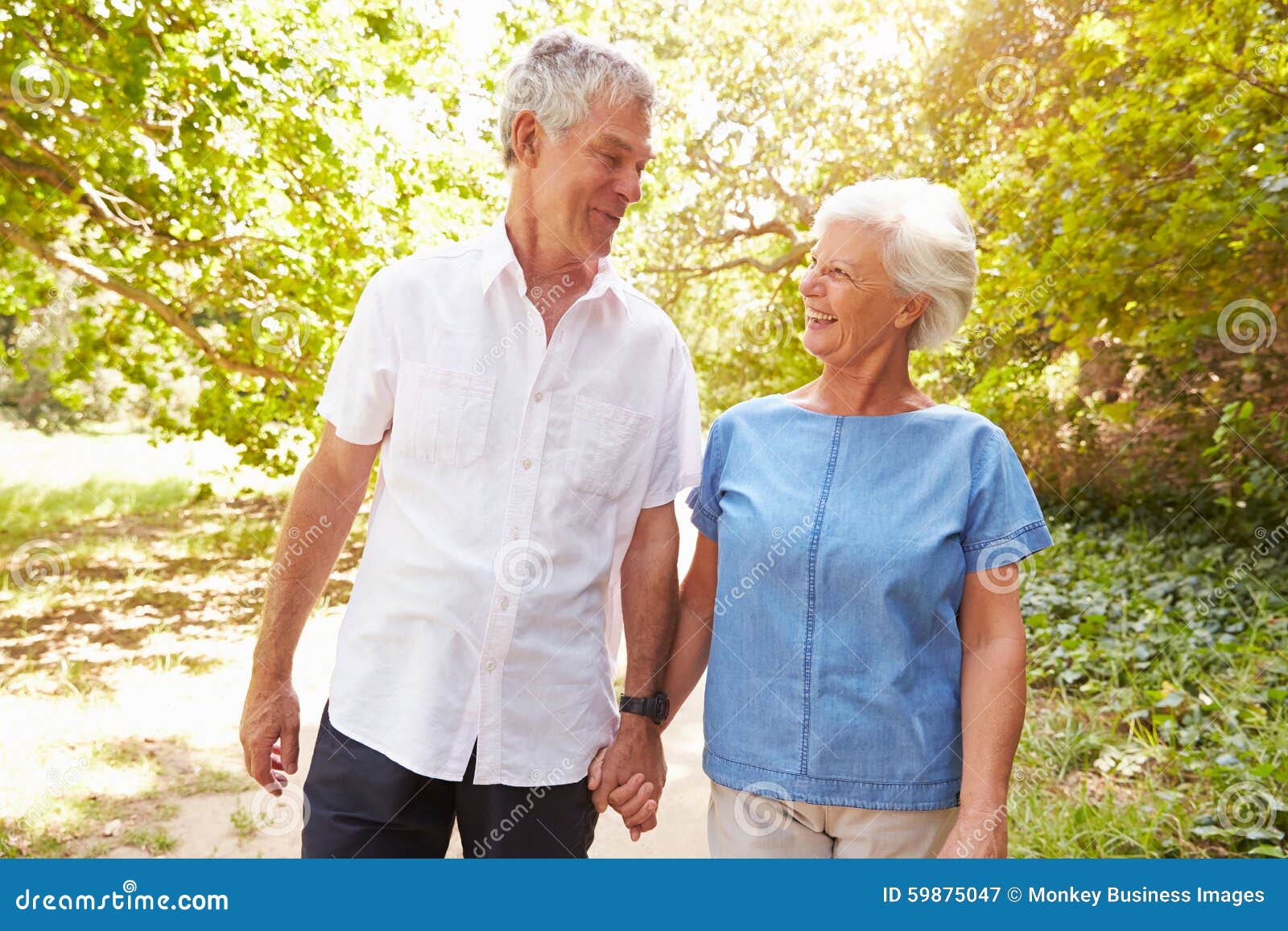 Senior Couple Walking Together in the Countryside Stock Image Image