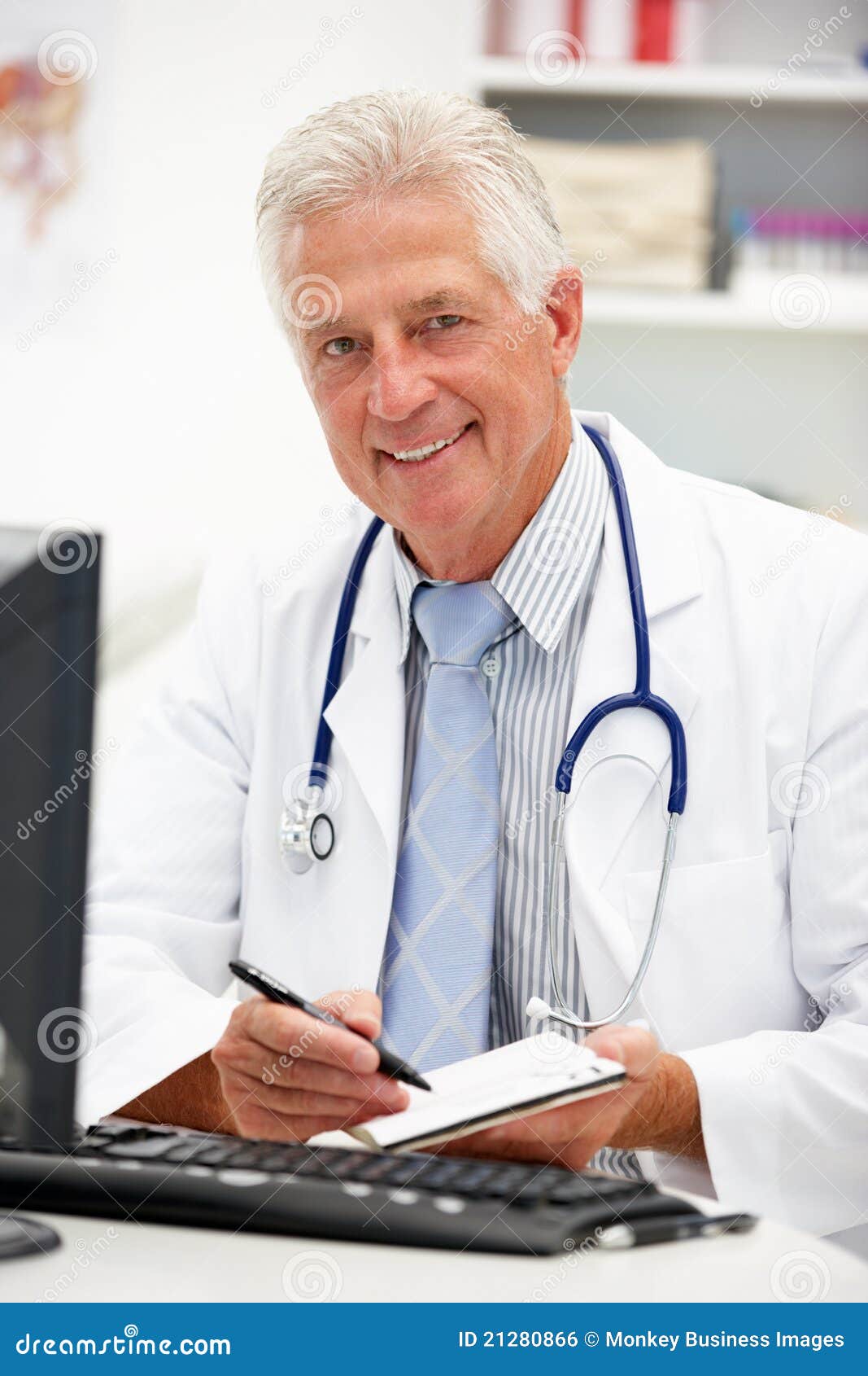 Senior Doctor at Desk Taking Notes Stock Photo - Image of doctor ...