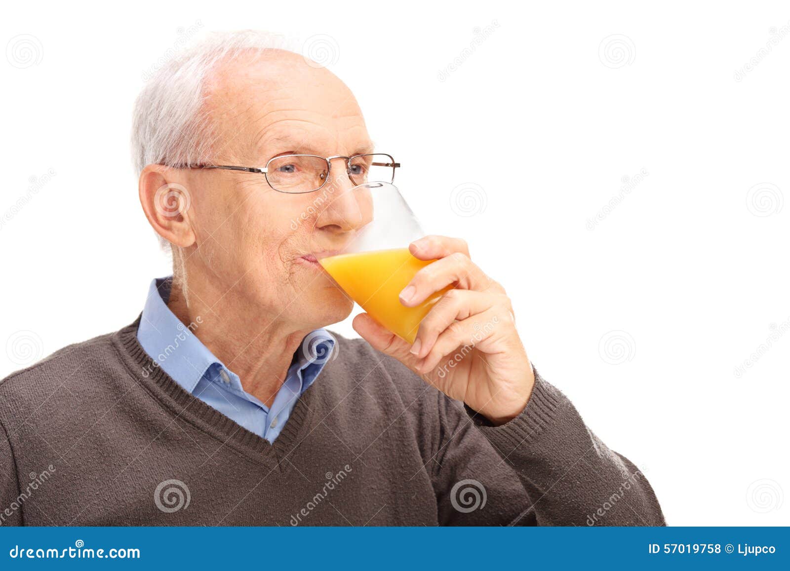 Photo about Studio shot of a senior drinking an orange juice isolated on wh...