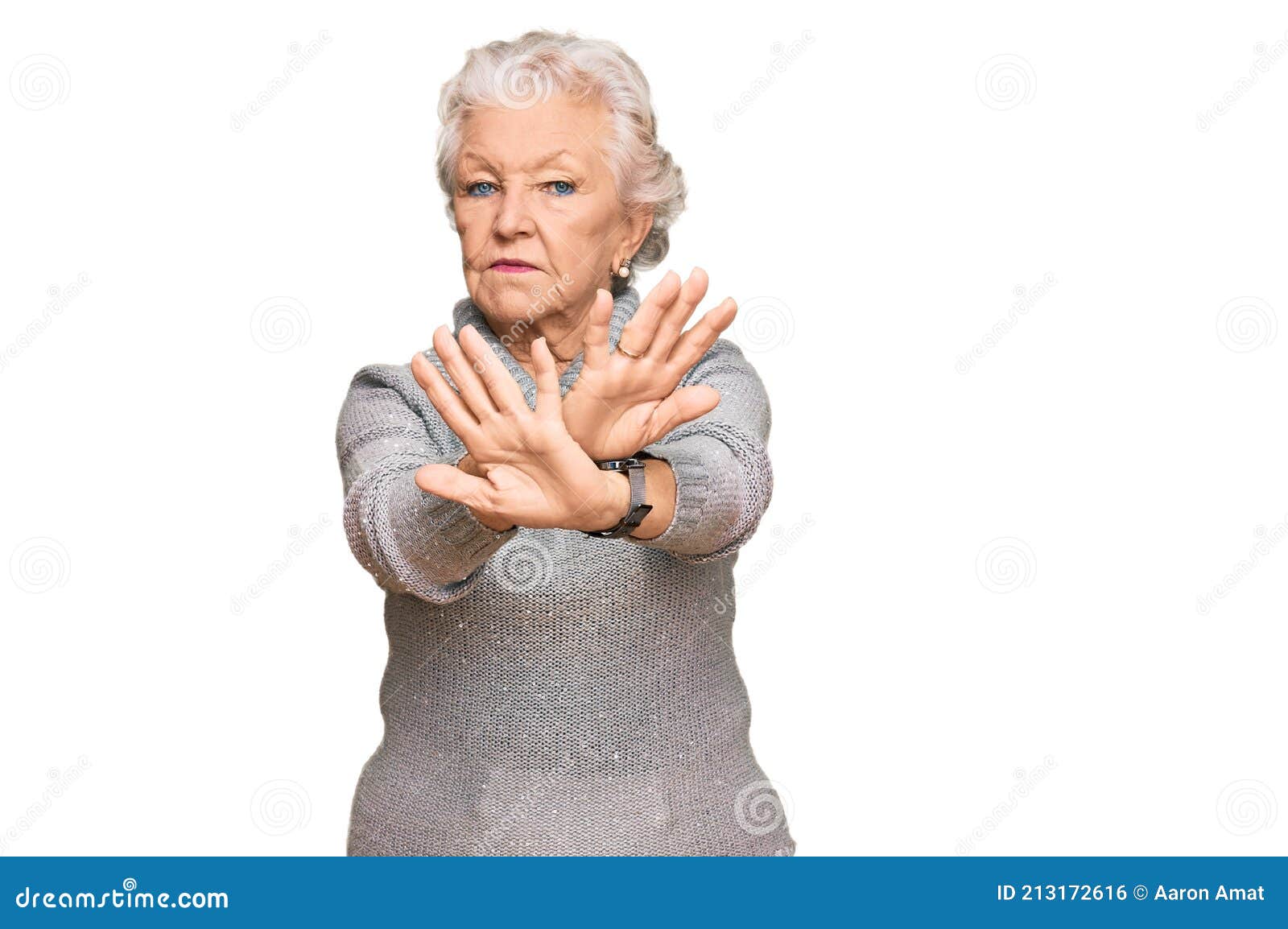 senior grey-haired woman wearing casual winter sweater rejection expression crossing arms and palms doing negative sign, angry