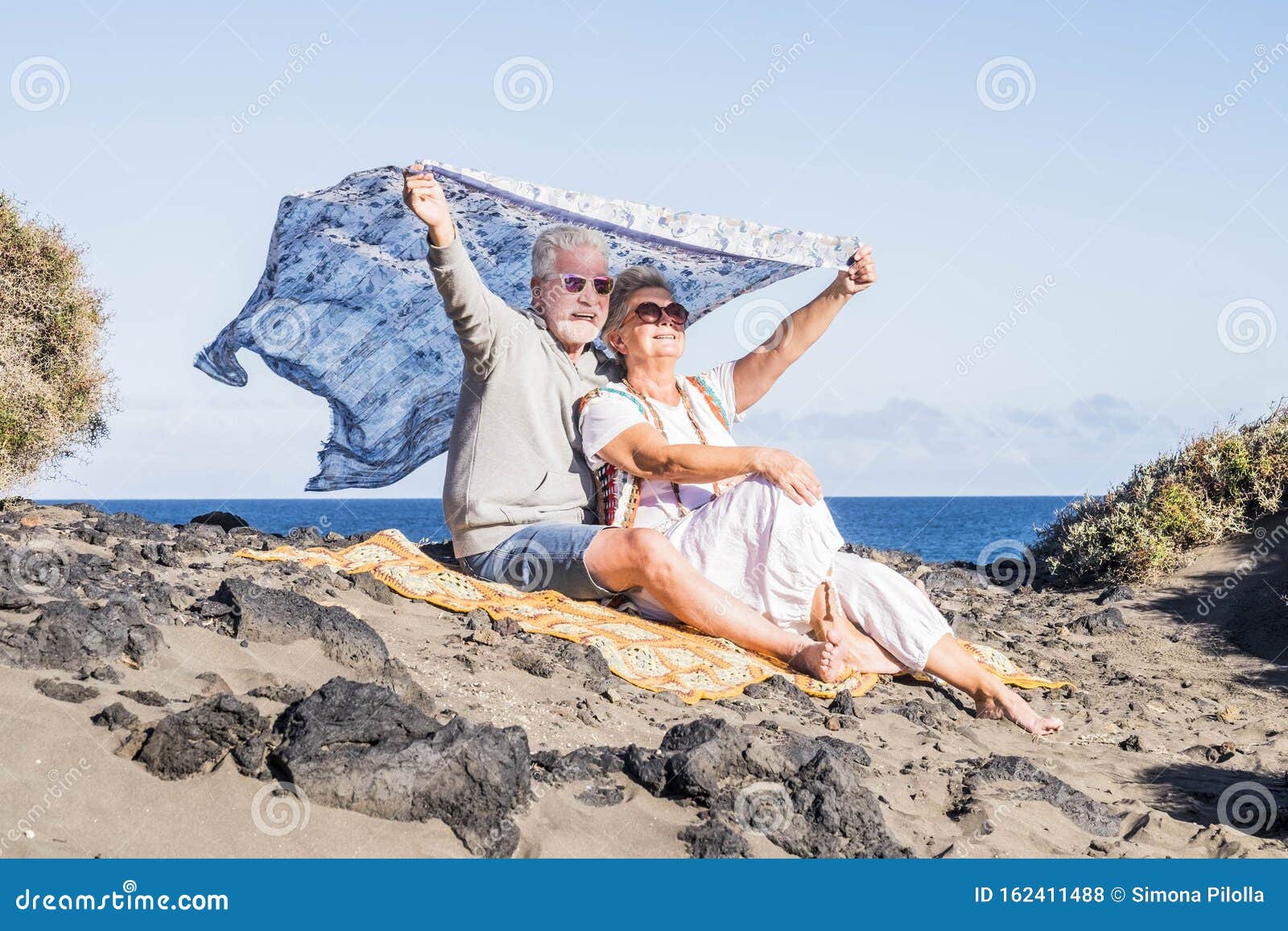 Interesting in nature's garb couple on the beach