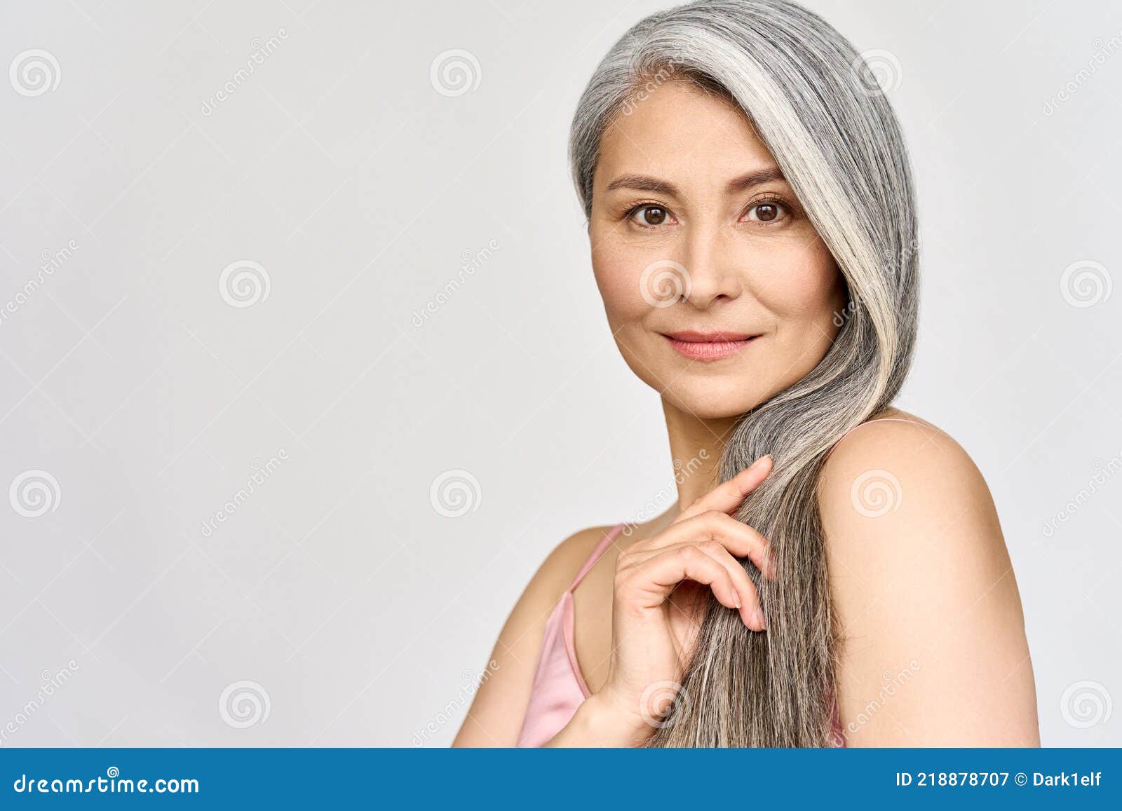 senior happy middle aged mature asian woman headshot portrait. hair care advertising.