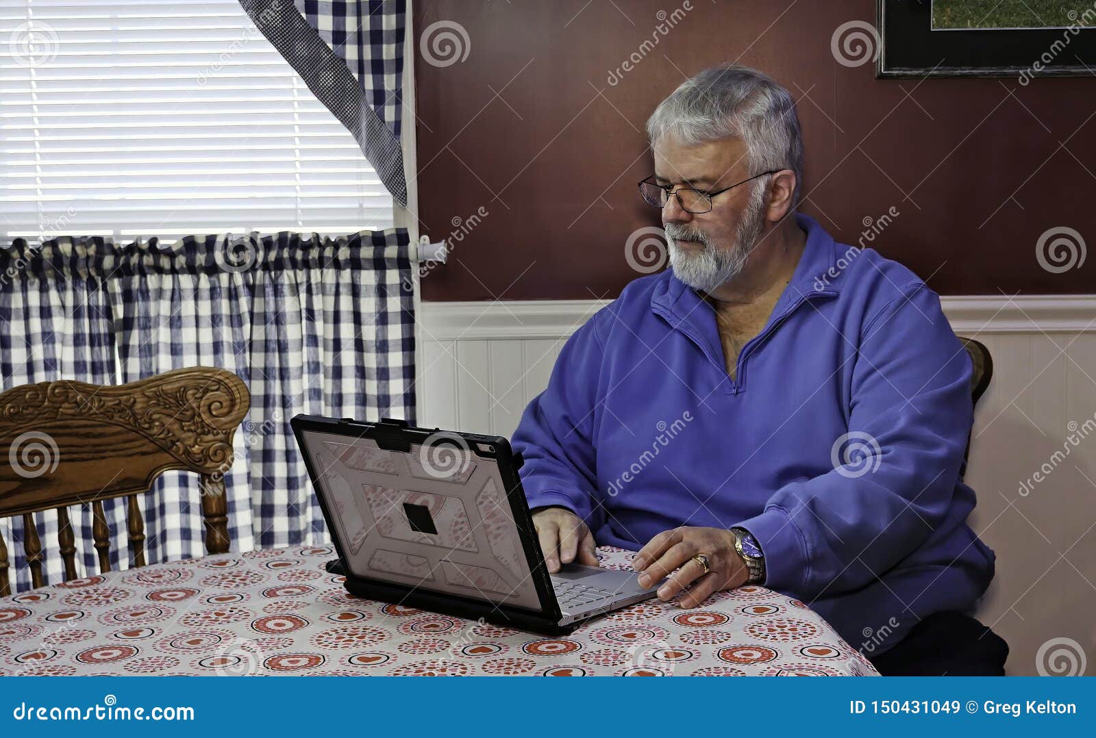 Senior Happy Using a Computer and Technology. Senior Citizen Happy Using a Computer and Technology to do Daily Activities