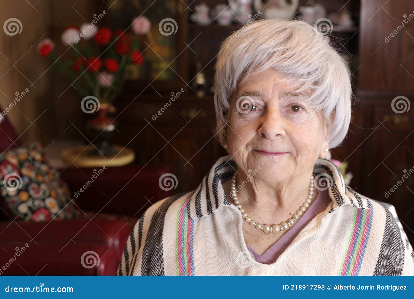 senior hispanic woman wearing a ruana