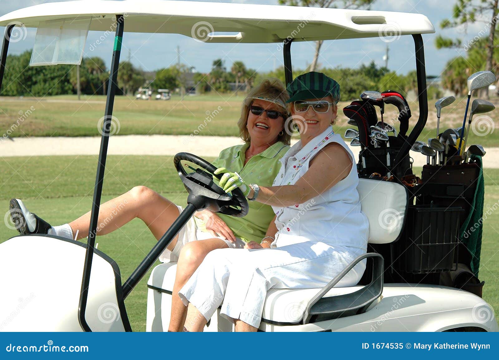 senior ladies in golf cart