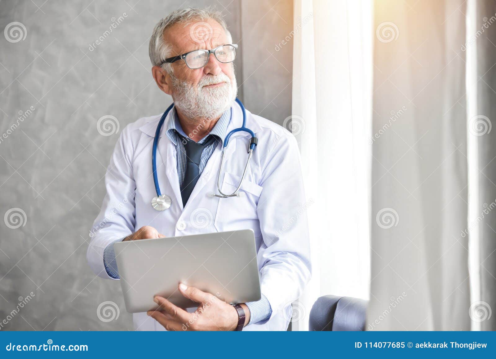 Senior Male Doctor is Using Laptop Computer. Stock Image - Image of ...