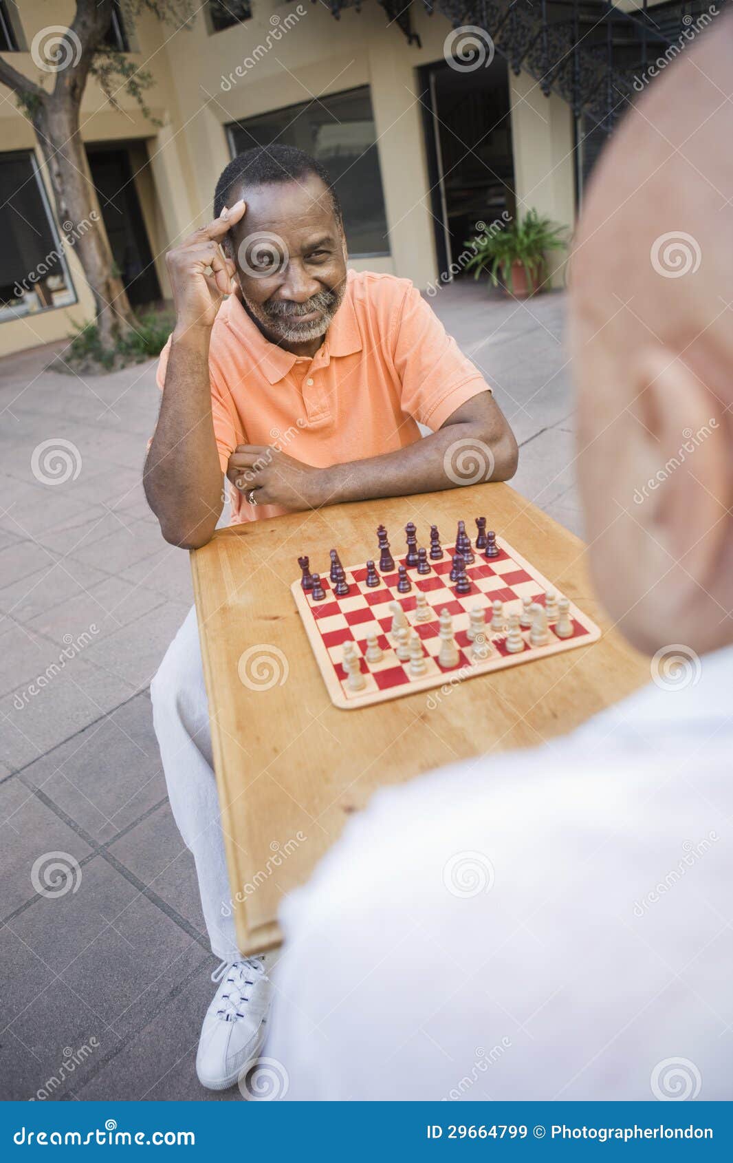 friends playing chess, Stock image