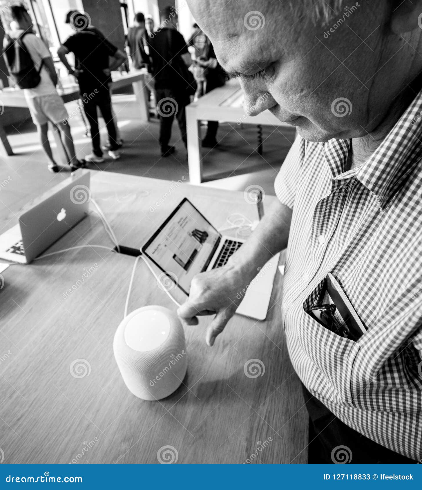 senior-man-apple-store-testing-homepod-speaker-siri-strasbourg-france-sep-curious-smart-iphone-xs-max-127118833.jpg