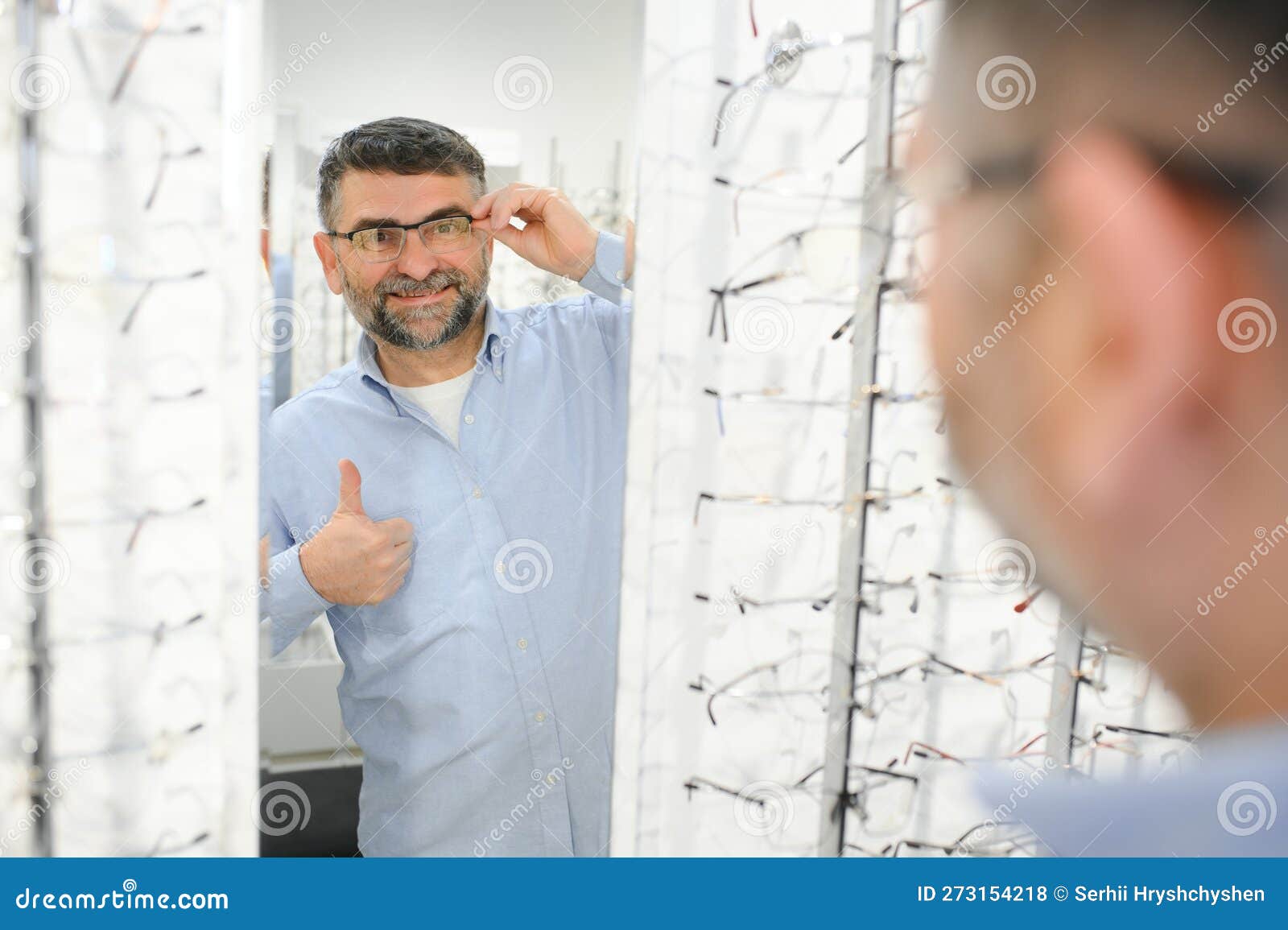 Senior Man Choosing Glasses in Optic Store. Stock Photo - Image of ...