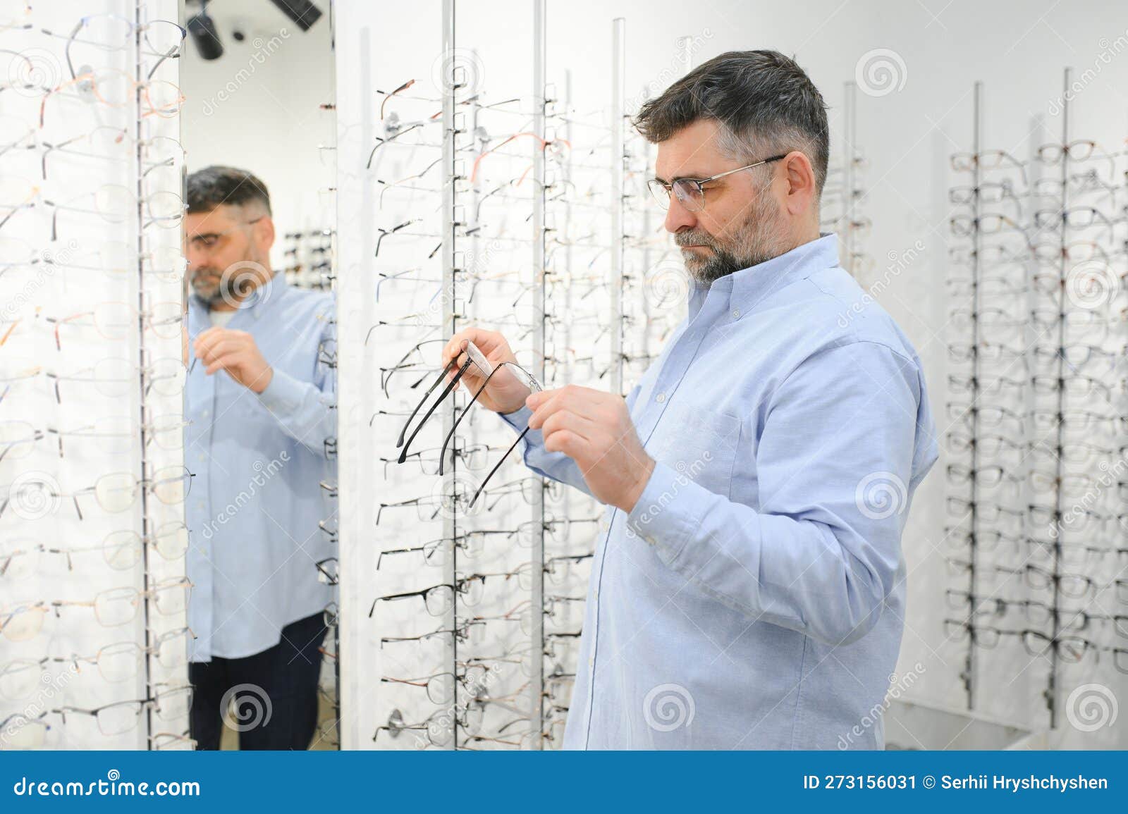 Senior Man Choosing Glasses in Optical Store, Try on Eyeglass Frames To ...