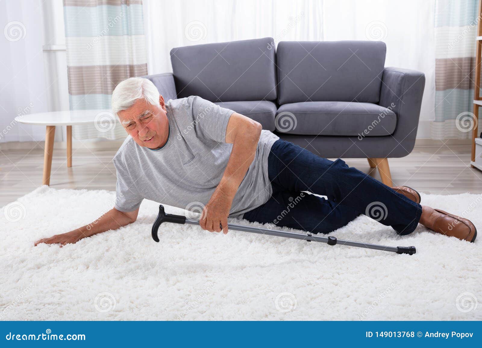 senior man fallen on carpet