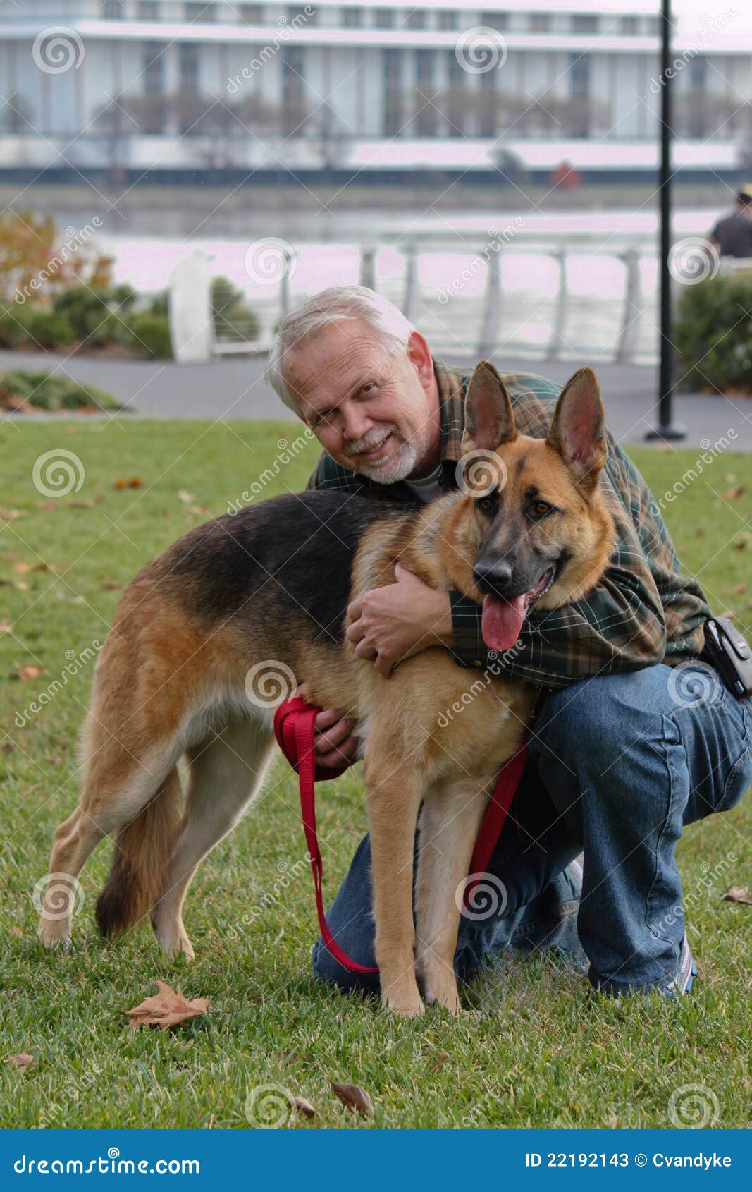 senior man and german sheperd dog