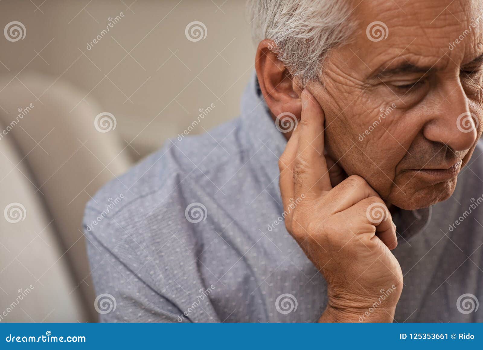 senior man with hearing problems