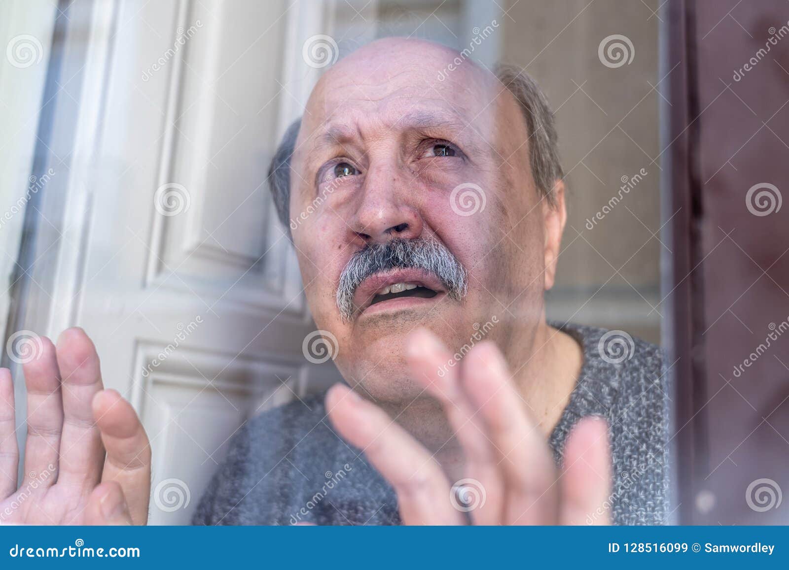 Depressed Old Man Looking Through The Window Feeling Alone And Unhappy