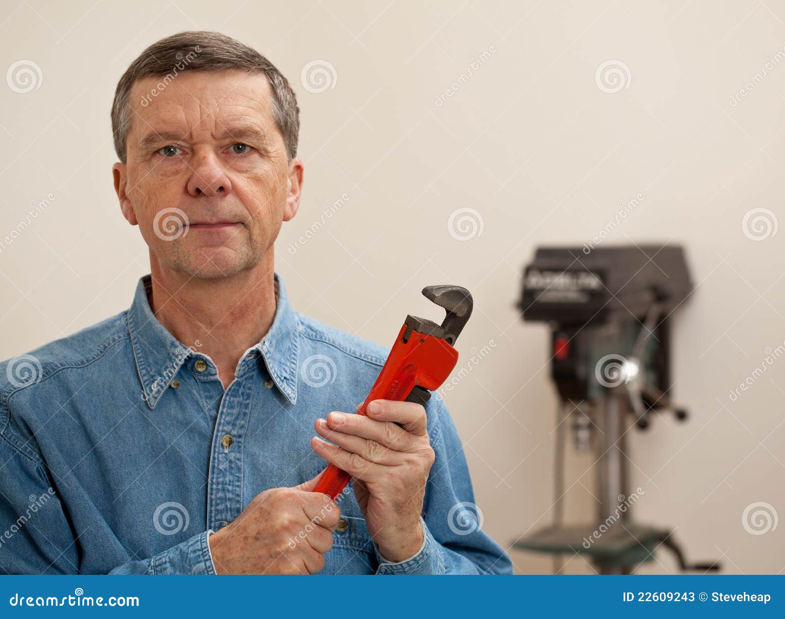 Senior Man Holding a Large Wrench Stock Image Image of spanner