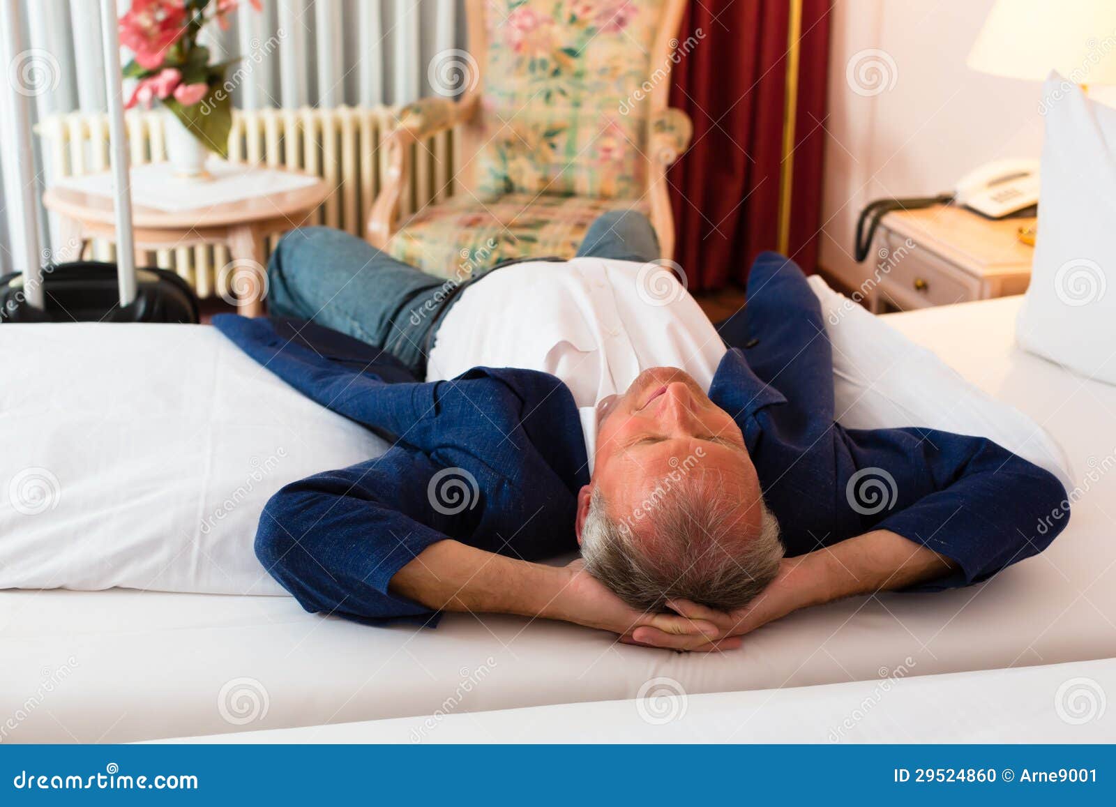 Senior Man Lying On The Bed In The Hotel Room Stock Photo ...