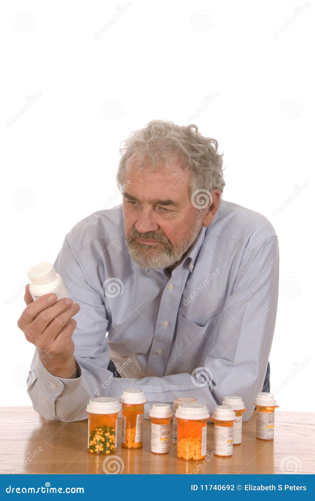 Senior Man with Medicine stock photo. Image of swallowing 11740692