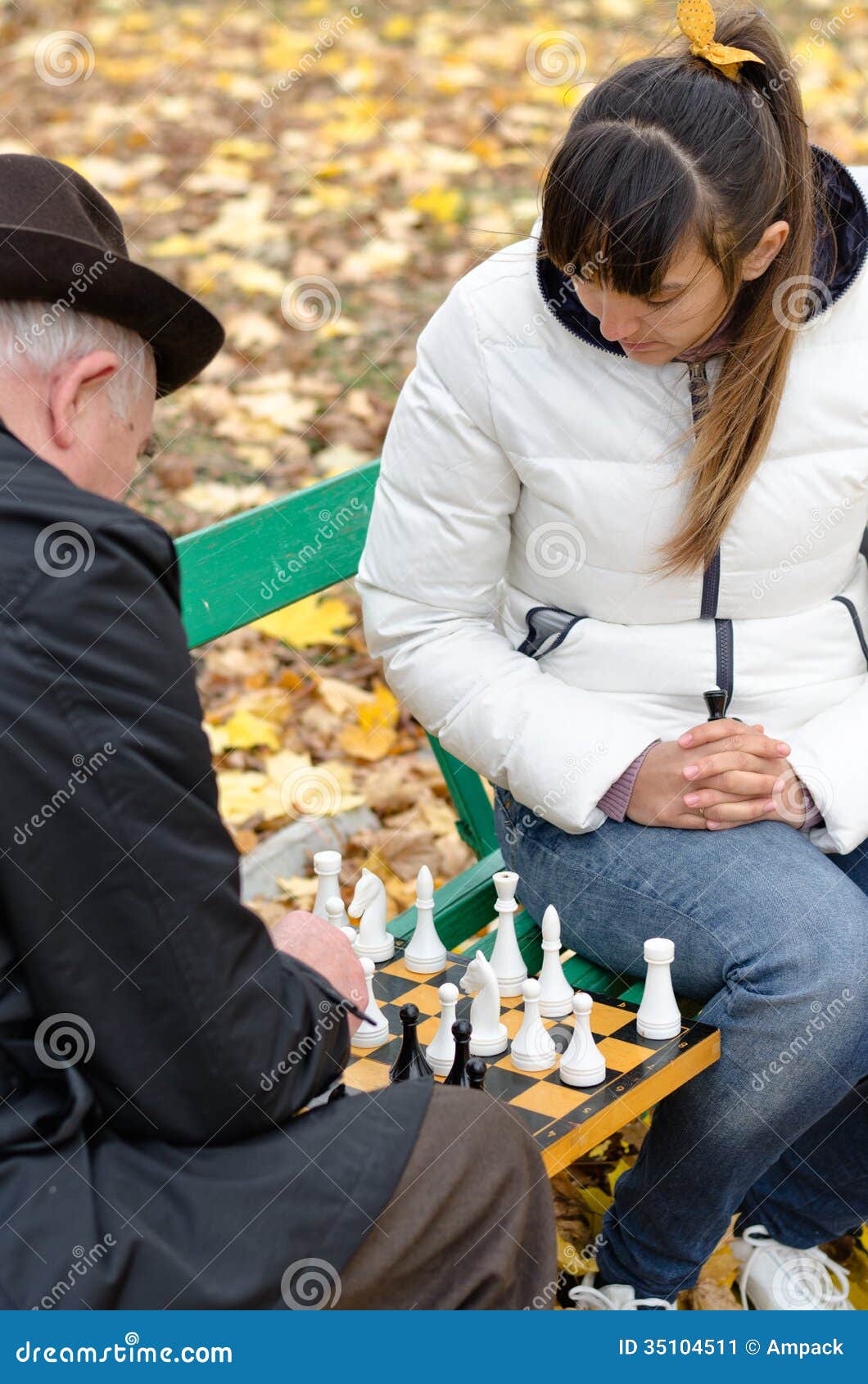 Senior man planning his next chess move, Stock image