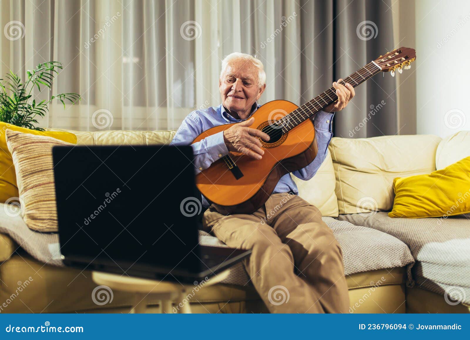 Senior Man Playing Guitar Using Laptop for Online Lessons Stock Photo Image of guitar, online