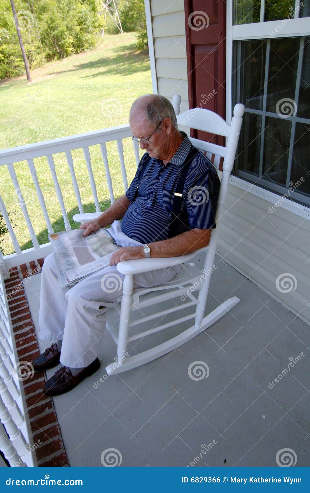 Senior Man Reading Newspaper On Front Porch Stock Photo Image Of