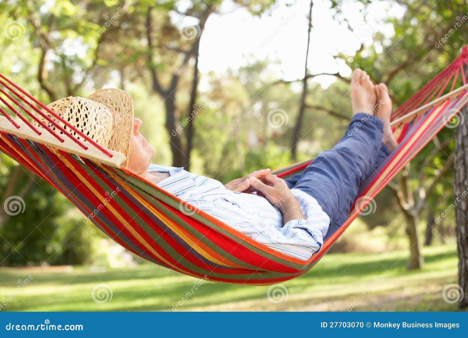 senior man relaxing in hammock