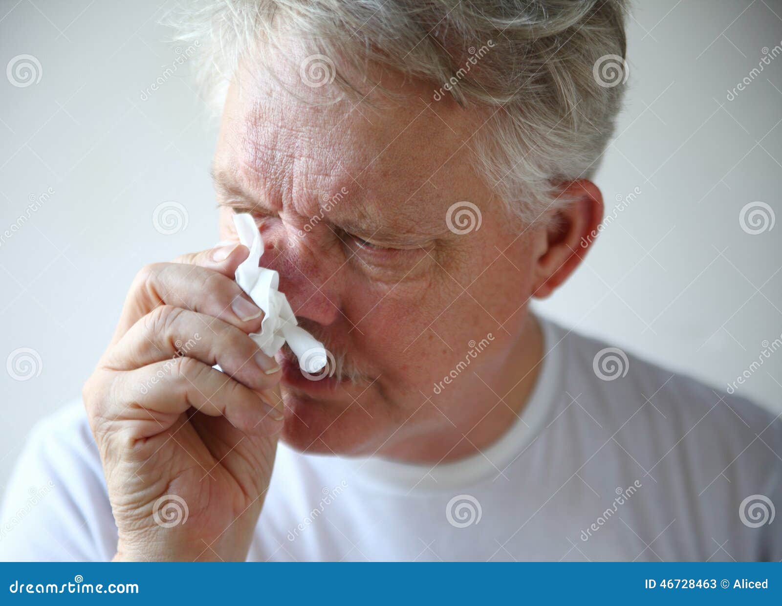 senior man with runny nose