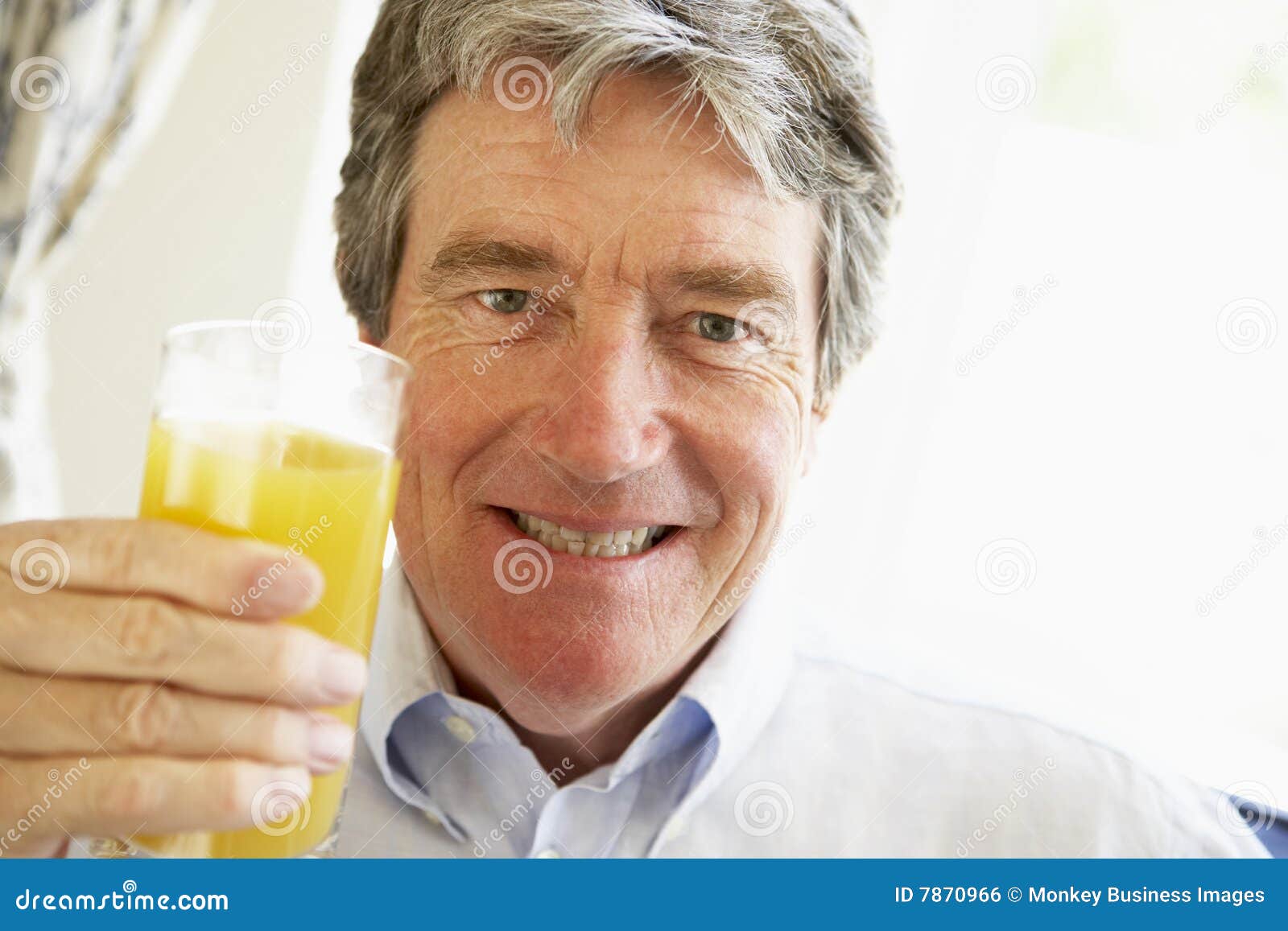 Senior Man Smiling and Drinking Orange Juice Stock Photo Image of