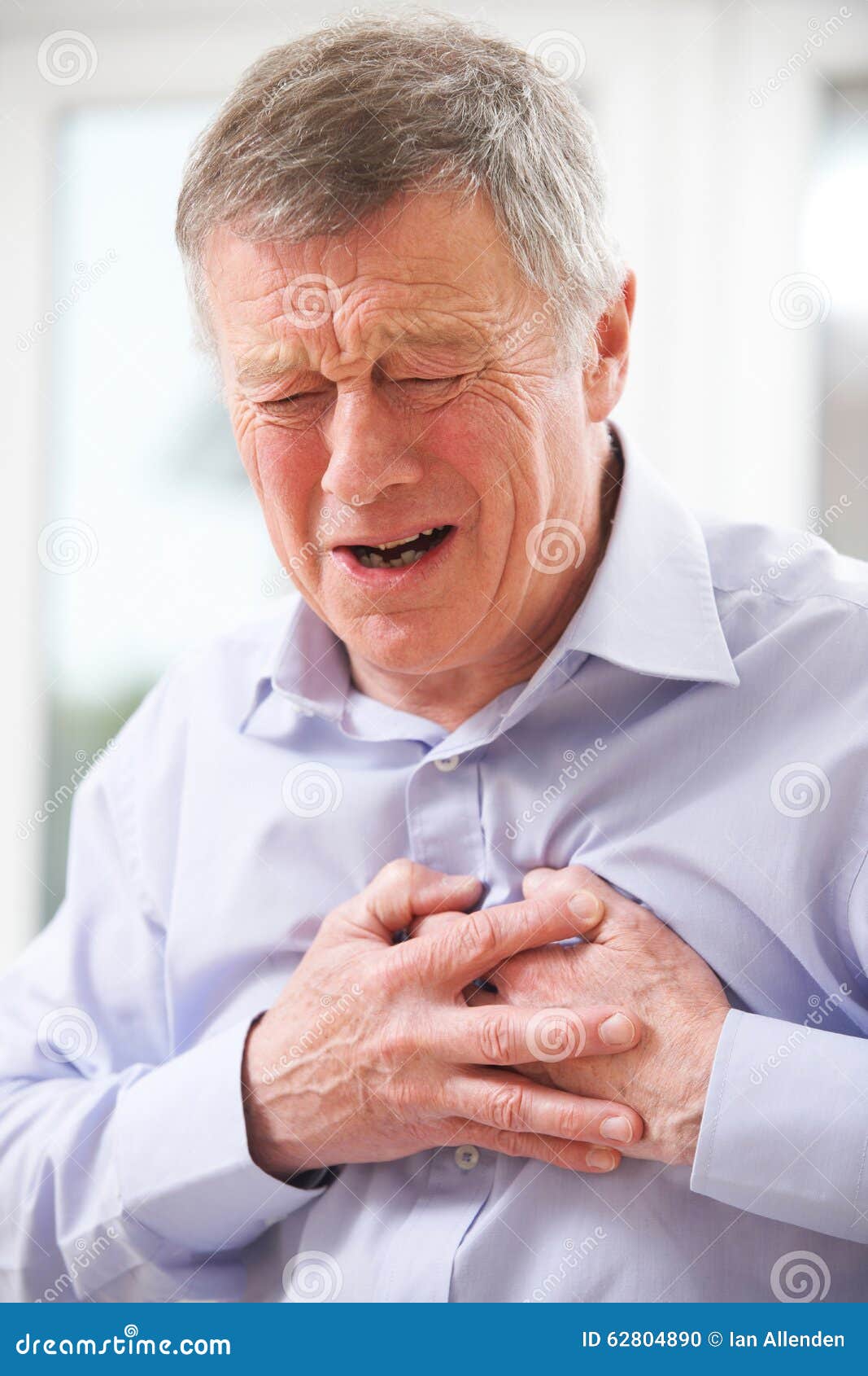 Senior Man Suffering Heart Attack at Home Stock Photo - Image of ...