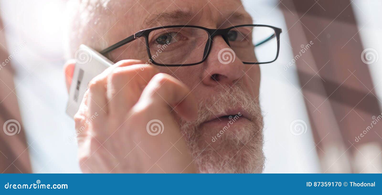 Senior Man Talking On Phone, Ray Effect Stock Photo