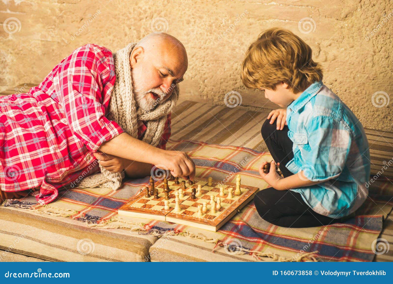 Senior man thinking about his next move in a game of chess Stock Photo by  dmytros9