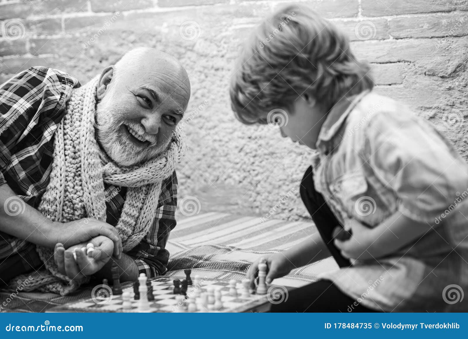 Handsome Male Model Considers His Next Chess Move Stock Photo