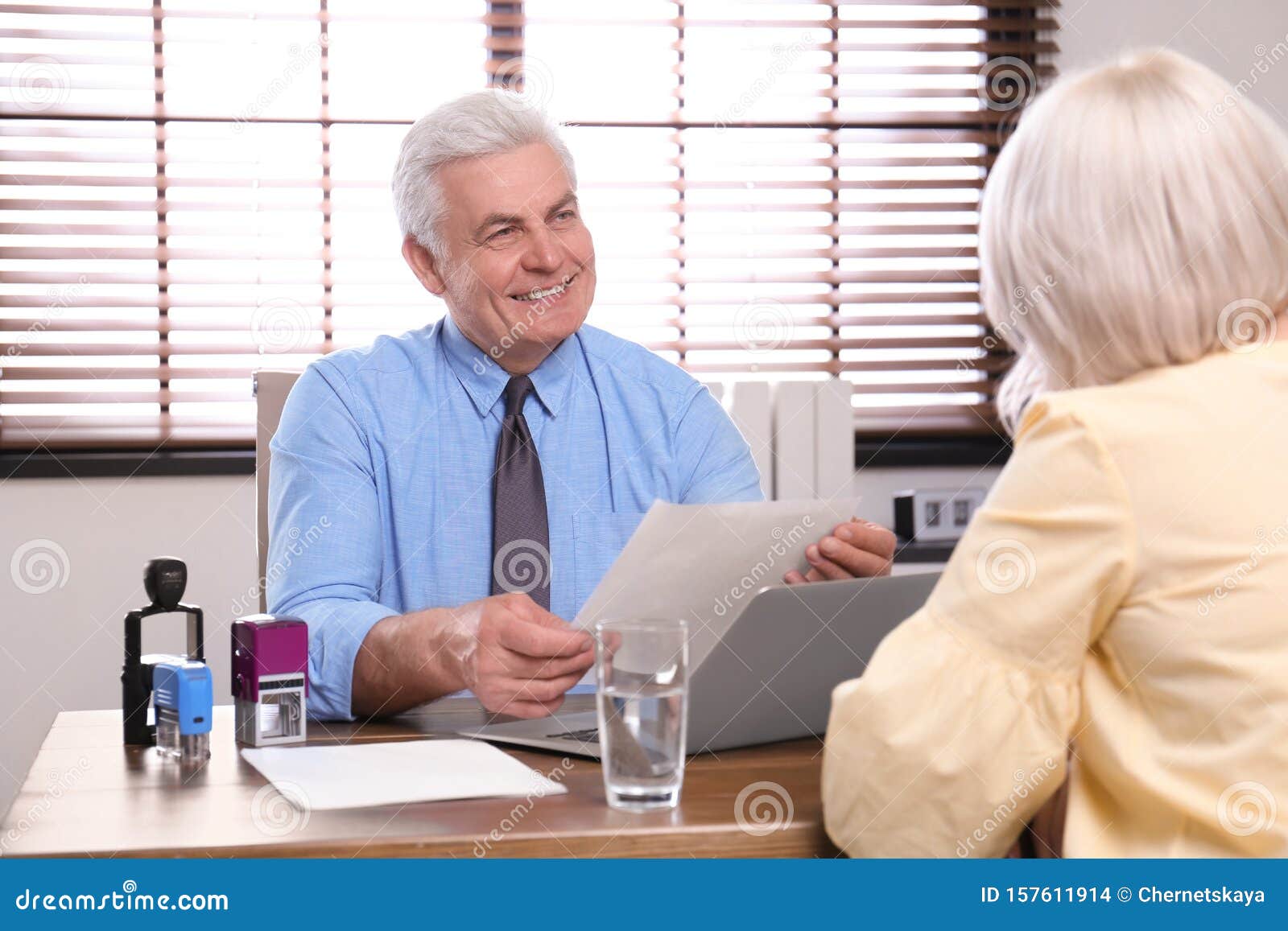 Senior Notary Working with Client Stock Photo Image of background
