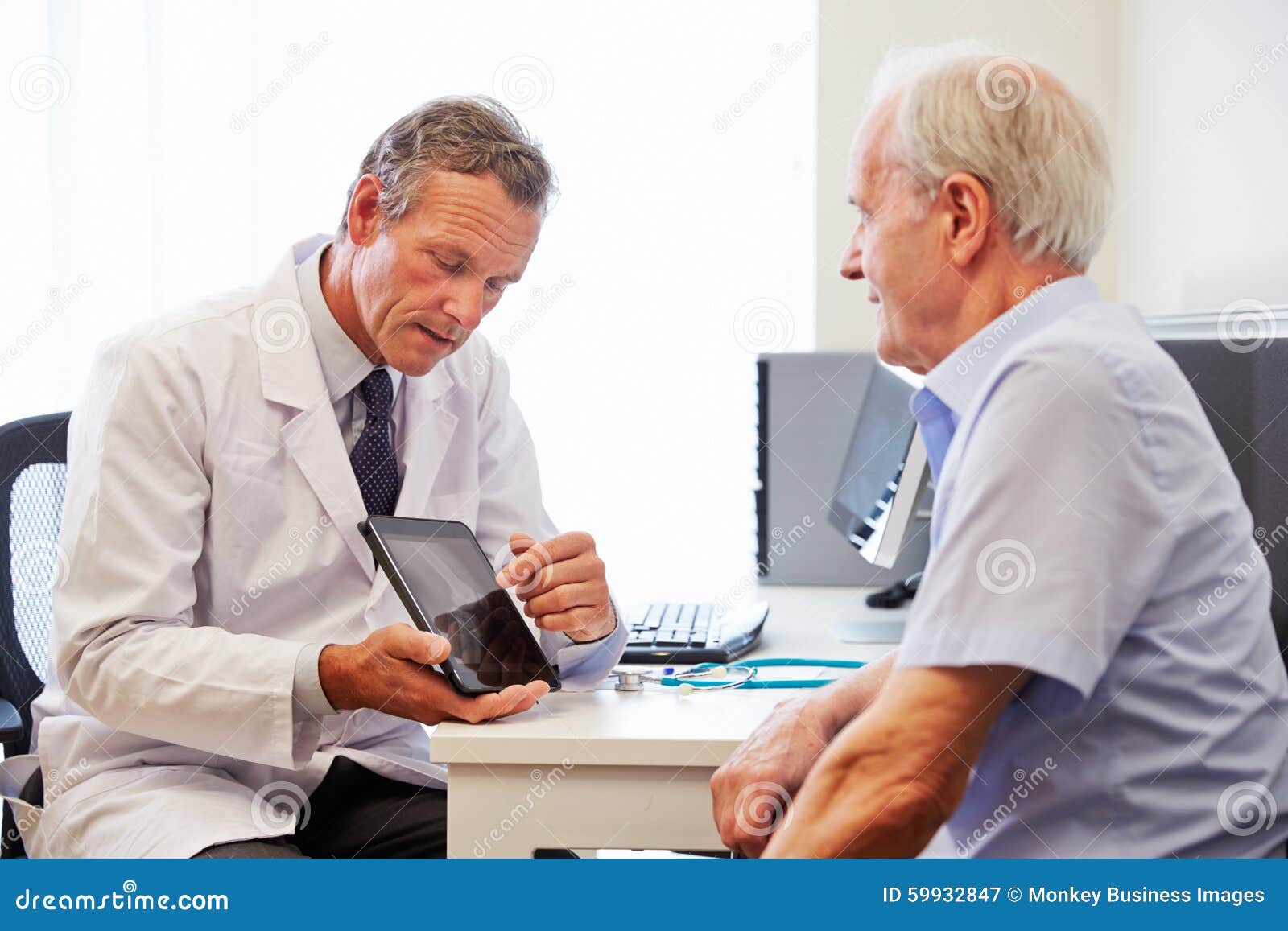senior patient having consultation with doctor in office