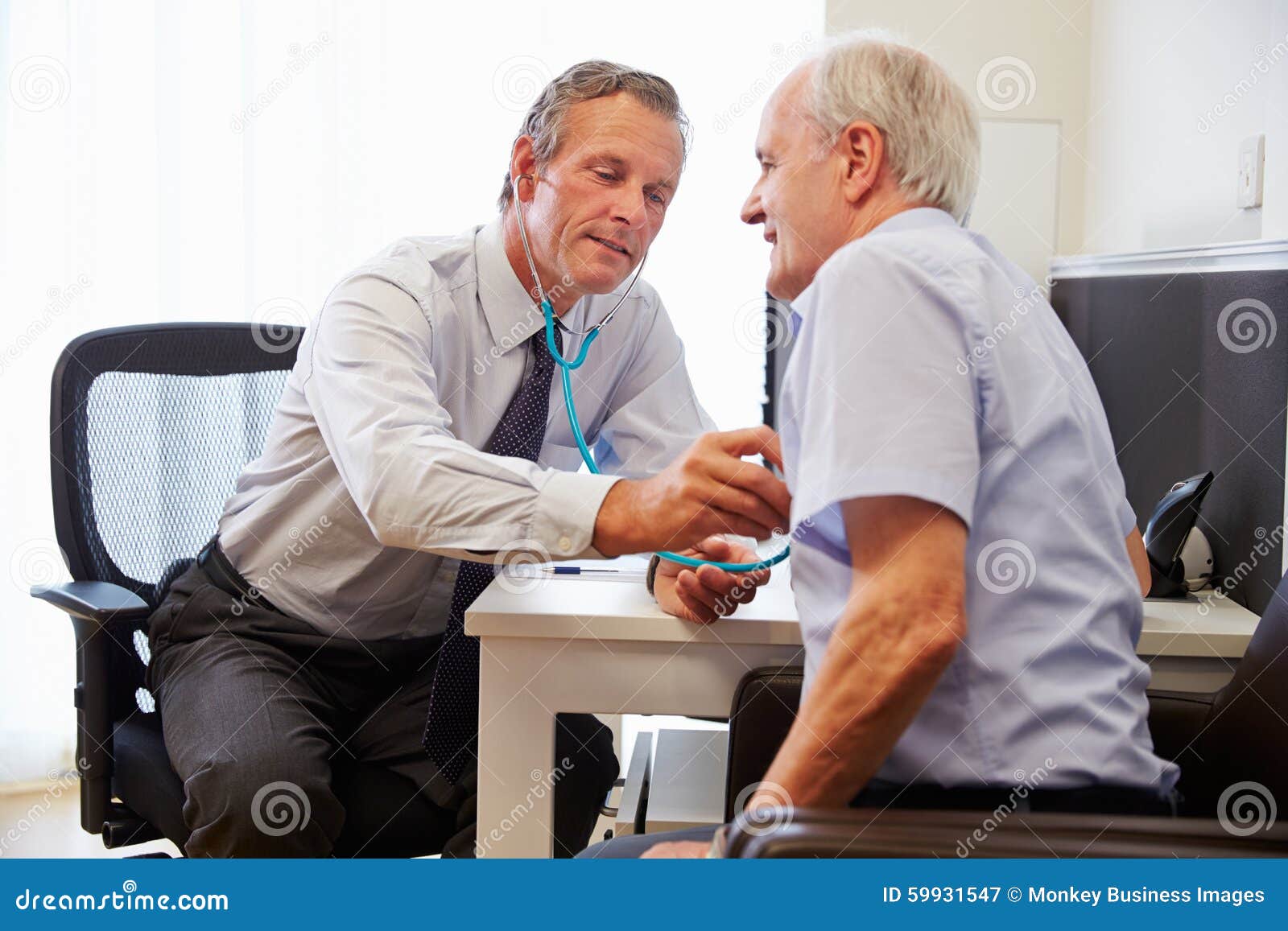 senior patient having medical exam with doctor in office