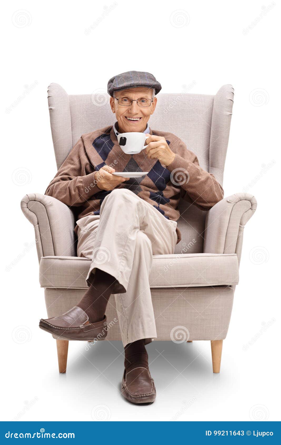 Senior Sitting in an Armchair and Having a Cup of Tea Stock Image